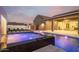 Stunning pool and spa at dusk with a water feature at 17662 W Whitefish Dr, Surprise, AZ 85388