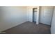 Spacious bedroom with plush carpet and ample closet space at 18841 E Bruno Dr, Gold Canyon, AZ 85118