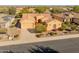 Single story house with solar panels and a two car garage, aerial view at 27106 W Marco Polo Rd, Buckeye, AZ 85396