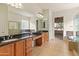 Elegant bathroom with double sinks, soaking tub, and separate shower at 27106 W Marco Polo Rd, Buckeye, AZ 85396