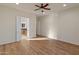 Main bedroom with hardwood floors and an ensuite bathroom at 27106 W Marco Polo Rd, Buckeye, AZ 85396