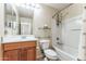 Clean bathroom with shower/tub combo and wood vanity at 2949 W Kristina Ave, San Tan Valley, AZ 85144