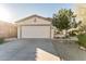 Single-story house with a two-car garage and landscaped front yard at 2949 W Kristina Ave, San Tan Valley, AZ 85144