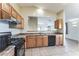 Bright kitchen featuring stainless steel appliances and wood cabinets at 2949 W Kristina Ave, San Tan Valley, AZ 85144