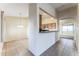 Bright kitchen features light wood cabinets and a breakfast bar at 2949 W Kristina Ave, San Tan Valley, AZ 85144