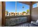 Apartment balcony view overlooking community and palm trees at 3500 N Hayden Rd # 106, Scottsdale, AZ 85251