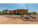 Landscaped backyard with fire pit and seating at 37547 W Washington St, Tonopah, AZ 85354