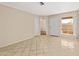 Living room with tile floors and door to outside at 409 W Pontiac Dr # 7, Phoenix, AZ 85027