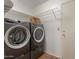 Laundry room with washer, dryer, and overhead shelving at 4607 E Piedmont Rd, Phoenix, AZ 85044