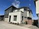 Modern two-story home with gray and white exterior and private gated entry at 4856 S Tune --, Mesa, AZ 85212
