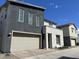 Two-story home with modern gray exterior, attached garage, and landscaped front yard at 4856 S Tune --, Mesa, AZ 85212