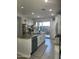 Island kitchen with granite countertops, white cabinets, and stainless steel appliances at 4856 S Tune --, Mesa, AZ 85212