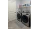 Laundry room with washer, dryer, and overhead shelving at 4856 S Tune --, Mesa, AZ 85212