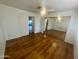 Bedroom with wood floors, mirrored closet doors, and access to a bathroom at 4901 S Calle Los Cerros Dr # 202, Tempe, AZ 85282