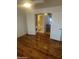 Bedroom with wood floors and adjacent bathroom and laundry at 4901 S Calle Los Cerros Dr # 202, Tempe, AZ 85282