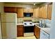 Well-equipped kitchen with wood cabinets and appliances at 4901 S Calle Los Cerros Dr # 202, Tempe, AZ 85282