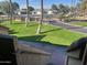 Landscaped lawn area with palm trees and a walkway at 4901 S Calle Los Cerros Dr # 202, Tempe, AZ 85282