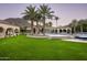 Luxury estate with expansive backyard, sparkling pool, and lush landscaping at 6161 N 59Th Pl, Paradise Valley, AZ 85253