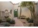 Inviting courtyard with fountain, cacti, and stone pathway at 6161 N 59Th Pl, Paradise Valley, AZ 85253
