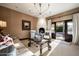 Elegant living room with fireplace and access to patio at 6161 N 59Th Pl, Paradise Valley, AZ 85253