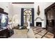 Elegant living room featuring a fireplace and access to the backyard at 6161 N 59Th Pl, Paradise Valley, AZ 85253
