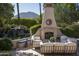 Outdoor patio with fireplace, seating area and waterfall at 6161 N 59Th Pl, Paradise Valley, AZ 85253