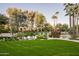 Expansive pond with arched stonework and lush landscaping at 6161 N 59Th Pl, Paradise Valley, AZ 85253