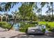 Picturesque pond with a wooden footbridge and palm trees at 6161 N 59Th Pl, Paradise Valley, AZ 85253