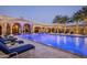 Inviting resort-style pool with blue illuminating lights at night at 6161 N 59Th Pl, Paradise Valley, AZ 85253