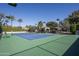 Private tennis court with green surface and surrounding fence at 6161 N 59Th Pl, Paradise Valley, AZ 85253