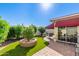 Artificial turf and patio area in sunny backyard at 6317 E Pinchot Ave, Scottsdale, AZ 85251