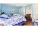 Bedroom with queen bed and light blue walls at 6317 E Pinchot Ave, Scottsdale, AZ 85251