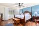 Large bedroom with king-size bed and hardwood floors at 6317 E Pinchot Ave, Scottsdale, AZ 85251