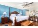 Spacious bedroom with king-size bed, hardwood floors, and ceiling fan at 6317 E Pinchot Ave, Scottsdale, AZ 85251
