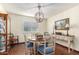 Elegant dining room with hardwood floors, chandelier, and built-in hutch at 6317 E Pinchot Ave, Scottsdale, AZ 85251