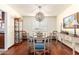 Charming dining room with hardwood floors, chandelier, and elegant furnishings at 6317 E Pinchot Ave, Scottsdale, AZ 85251