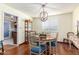 Well-lit dining area, hardwood floors, and view into the kitchen at 6317 E Pinchot Ave, Scottsdale, AZ 85251