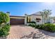 Spanish style home with a brick driveway and mature landscaping at 6317 E Pinchot Ave, Scottsdale, AZ 85251