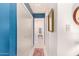 Light and bright hallway with tile flooring and access to bathroom at 6317 E Pinchot Ave, Scottsdale, AZ 85251