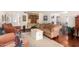 Living room with hardwood floors, decorative built-ins, and comfortable seating at 6317 E Pinchot Ave, Scottsdale, AZ 85251