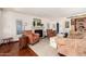 Living room with hardwood floors, fireplace, and comfortable seating at 6317 E Pinchot Ave, Scottsdale, AZ 85251