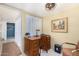 Home office with vintage desk and chair, adjacent to hallway at 6317 E Pinchot Ave, Scottsdale, AZ 85251
