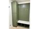 Mudroom with green cabinets, bench, and cubbies at 670 W Barrow Dr, Chandler, AZ 85225