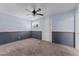 Simple bedroom with carpeted floor and ceiling fan at 735 W Hermosa Dr, Wickenburg, AZ 85390