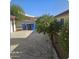 Backyard view with an orange tree and garbage cans at 849 N Revere St # B, Mesa, AZ 85201