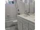 Bathroom with a shower/tub, double vanity, and tiled walls at 849 N Revere St # B, Mesa, AZ 85201