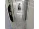 Clean hallway with tile floors and storage at 849 N Revere St # B, Mesa, AZ 85201