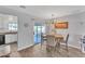 Modern dining area with a view of the backyard and kitchen at 8760 W Meadow Dr, Peoria, AZ 85382