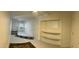 Finished basement area with built-in shelving and carpet at 9623 E Baywood Ave, Mesa, AZ 85208