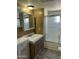 Bathroom with tub, shower, and double vanity at 9623 E Baywood Ave, Mesa, AZ 85208